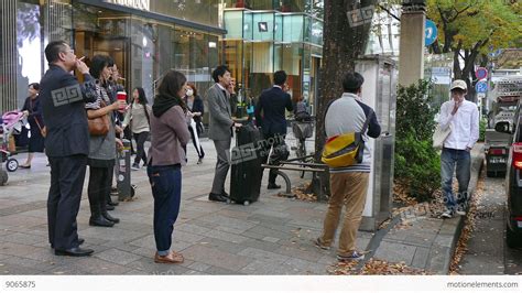 People Smoking Cigarettes In The Streets Of Tokyo Japan Asia Stock