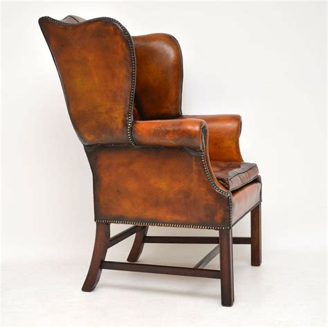 Leather wing back chairs are a traditional favorite. Antique Leather Wing Back Armchair - Marylebone Antiques