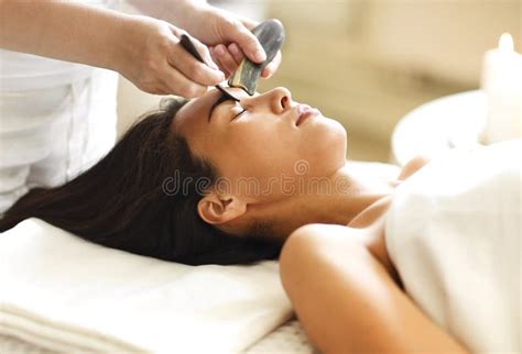 face massage or beauty treatment in spa salonface massage or beauty treatment in spa salon stock