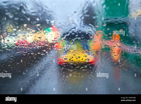 Driving In The Rain Drops On The Windshield Wet Road Police Vehicle Rear View Stock Photo Alamy