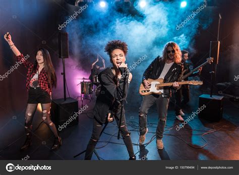 Rock Band On Stage — Stock Photo © Tarasmalyarevich 150799494