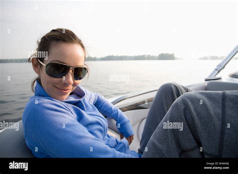 Woman Relaxing In Boat Stock Photo Alamy