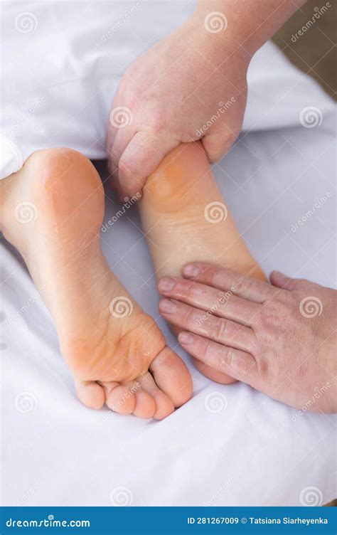 Close Up Of Physiotherapist Giving A Patient A Foot Massage Treatment Reflexology Foot Massage