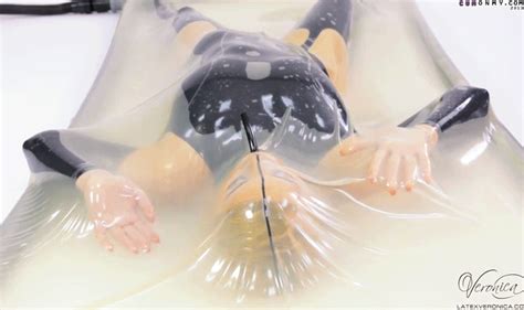 Wearing A Catsuit Masturbating Inside A Latex Vacuum Bed