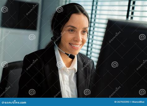 Competent Female Operator Working On Computer And While Talking With