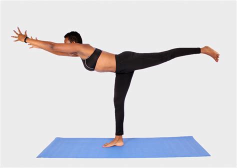 Young Woman Doing Balance Yoga Pose