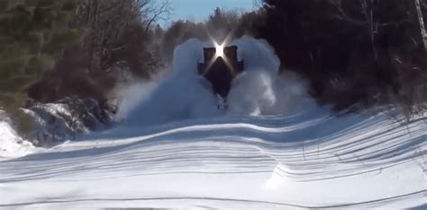 Watch This Train Plow Through Snow Covered Tracks Like A Ship In The