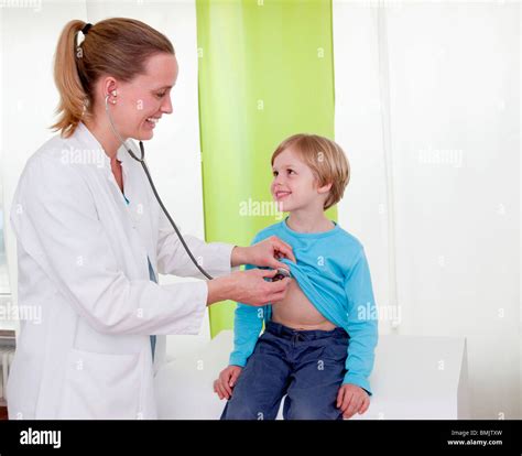 Doctor Examining Boy Stock Photo Alamy