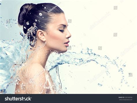Beautiful Model Woman With Splashes Of Water In Her Hands Beautiful