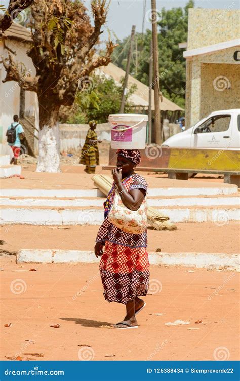 unidentified local woman carries a bucket on her head in the ce editorial stock image image of