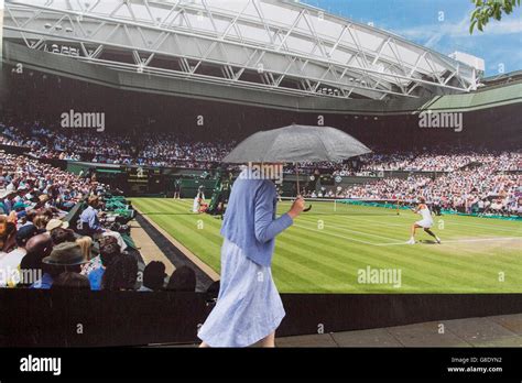 Wimbledon Londonuk 28th June 2016 A Pedestrian With An Umbrella