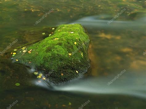Big Mossy Sandstone Boulders In Water Of Mountain River Clear Blurred