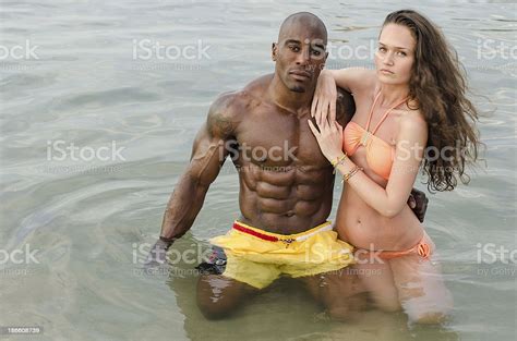 Black Man And White Girl - Fit Couple On The Beachblack Man And White Woman Stock Photo - Download