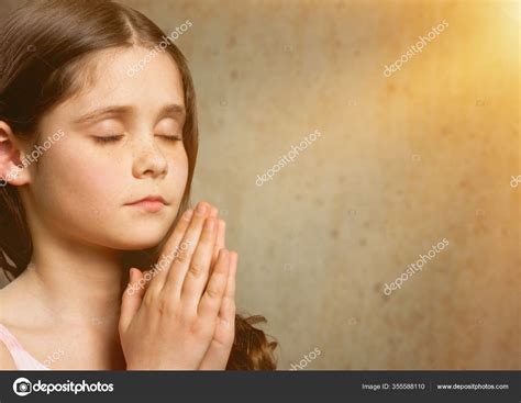 Cute Little Girl Praying Stock Photo By ©billiondigital 355588110