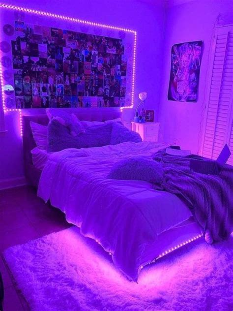 A Bed With Purple Lights In A Bedroom Next To A Window And Pictures On