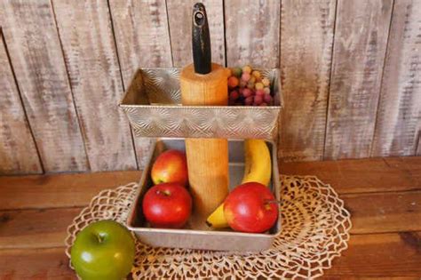 This Tiered Fruit Stand With Rolling Pin Center Feels So Unique And