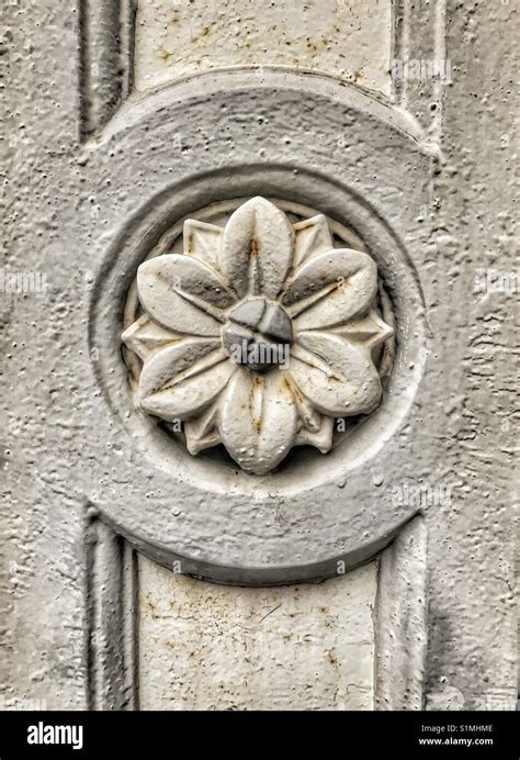 Architectural Detail Of Carved Flower In Stone Rough Texture And