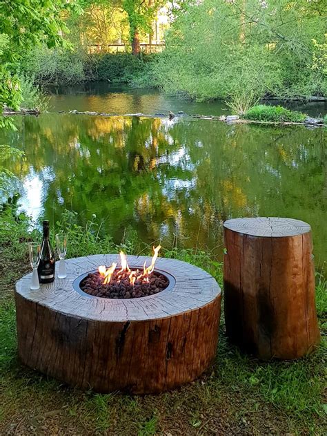This fire pit comes in an attractive design that blends perfectly with outdoor furniture. Burning Stump gas fire pit from Elementi Fires (Ireland)