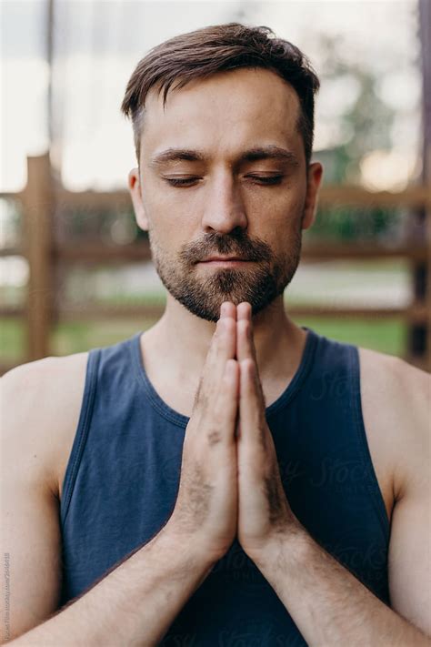 Portrait Of A Young Caucasian Yoga Man With Palms Folded As A Praying