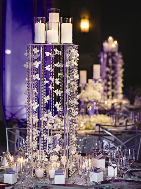 Candles look dreamy and romantic, especially surrounded by a wreath of flowers or hanging from a tall floral centerpiece. The Best Candle Centerpieces Wedding Decor & Ideas