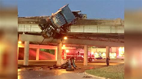 18 Wheeler Hangs Off Interstate After Fiery Crash