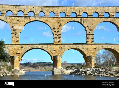 The Ancient Roman Pont Du Gard Aqueduct And Viaduct Bridge Over The