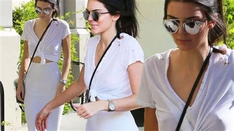 kendall jenner flashes nipple piercing in risqué see through top as she attends kim s surprise