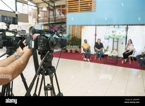 Television Studio With Professional Cameras Broadcasting A Live Show On