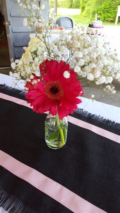 Milk Bottle Centerpieces With Gerber Daisies And Baby S Breath
