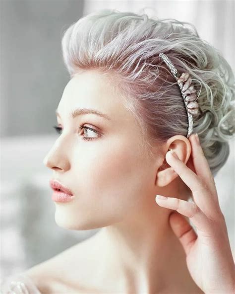 A Woman With Grey Hair Wearing An Ear Cuff