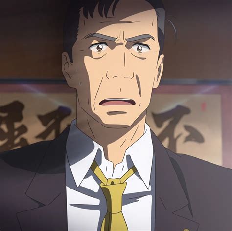 A Man In A Suit And Tie Looking At The Camera With An Angry Look On His