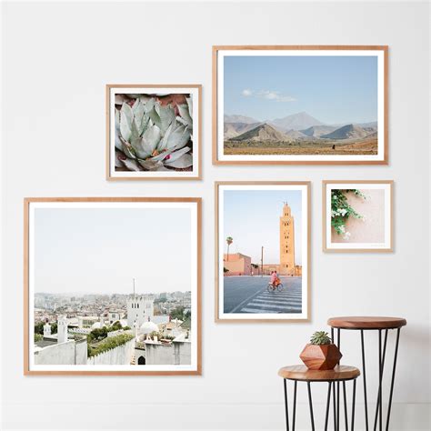 asymmetrical gallery wall with light wood frames | Gallery wall frames, Frame wall collage ...