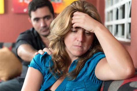 sad wife with her husband in the background stock image image of adult difficulties 49303369