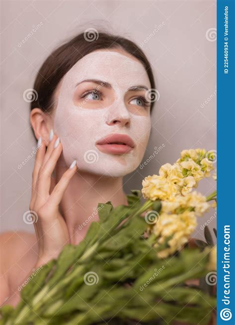 Spa Woman Applying Facial Clay Mask Beauty Treatments Stock Photo