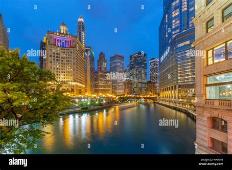 View Of Chicago River And Buildings Illuminated At Dusk Chicago