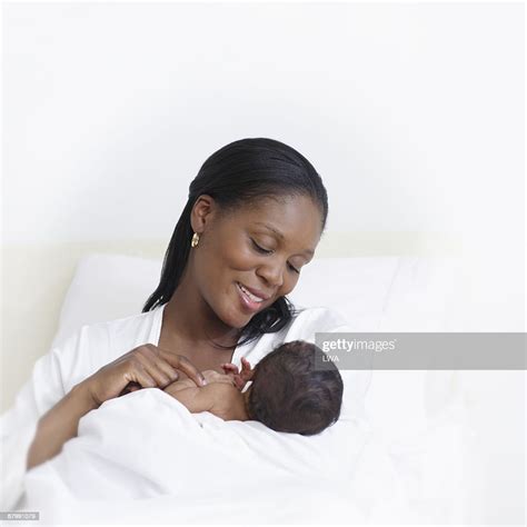 Mother Admiring Newborn Son High Res Stock Photo Getty Images