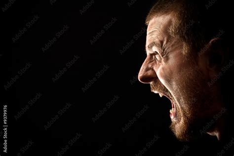 Face Of Angry Man Screaming Isolated On Black Stock Foto Adobe Stock