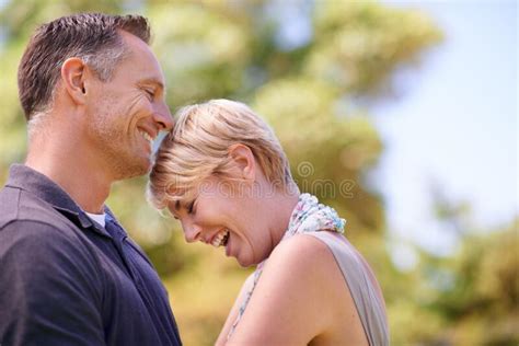 The Perfect Combination Of Love And Laughter Shot Of A Mature Couple Sharing A Tender Moment