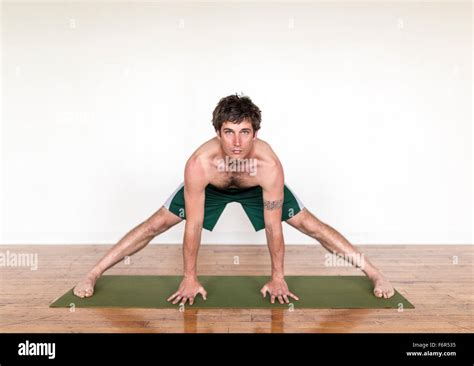 Man Practicing Yoga In Studio Stock Photo Alamy