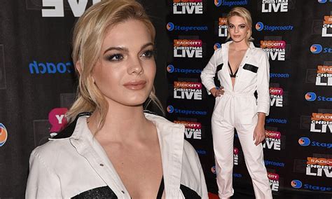 louisa johnson flashes her bra in white boiler suit at liverpool concert daily mail online