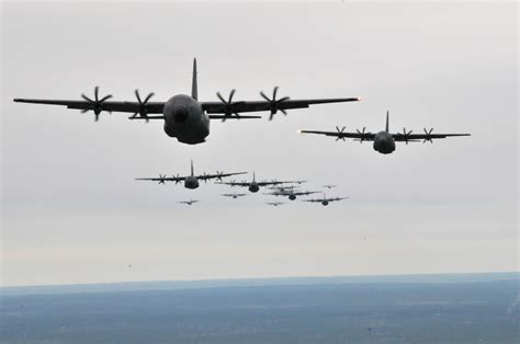 C 130j Hercules And Wc 130j Hercules Fly In Formation During An