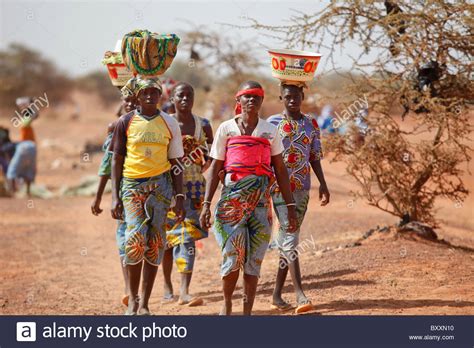 Women Arrive In The Town Of Djibo Burkina Faso On Foot