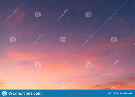 Beautiful Shot Of Pink Clouds In A Clear Blue Sky With A Scenery Of