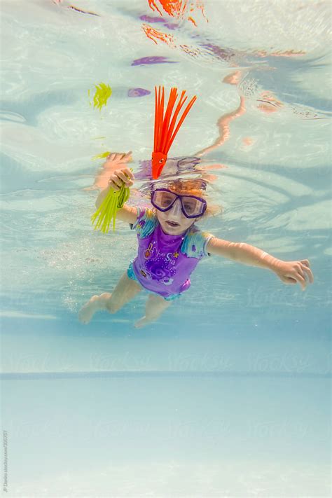 Girl Swimming Underwater In Outdoor Swmimming Pool Diving For Pool Toys