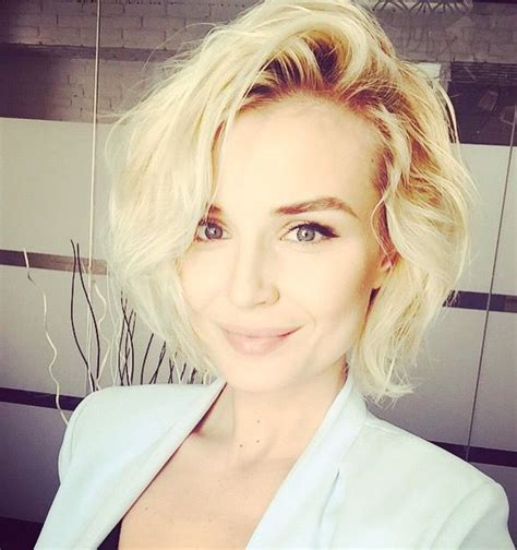A kiss may be grand but it won't pay the rental on your humble flat or help you at the automat. Polina gagarina blonde short hair curls Brown roots ...