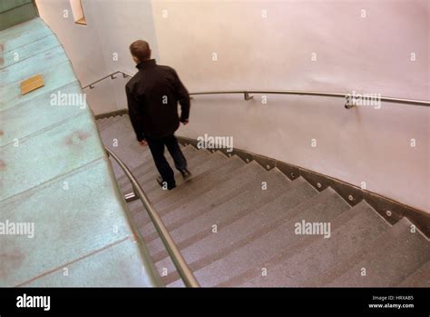 Man Walking Down Stairs Stock Photos And Man Walking Down Stairs Stock