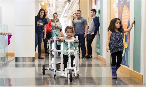 Student Engineers Help Kids With Disabilities Walk Play With Peers
