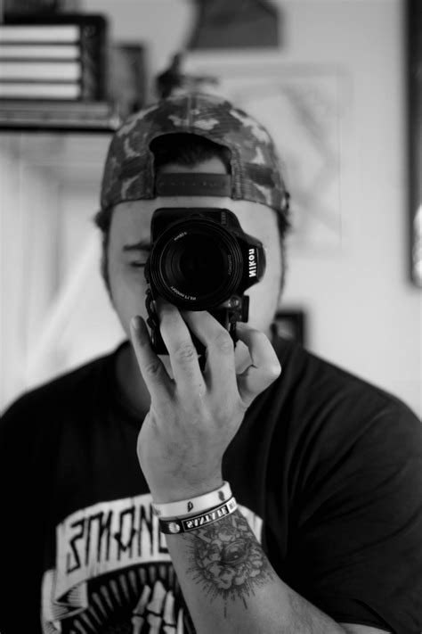 Unrecognizable male photographer working in studio · Free Stock Photo