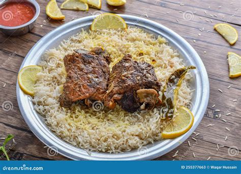 Arabian Mandi Meat With Lemon Slice And Sauce Served In Dish Top View