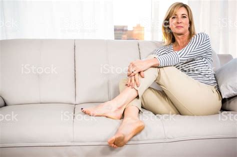 Woman Relaxing On The Sofa At Home Women Stock Images Free Womens Feet